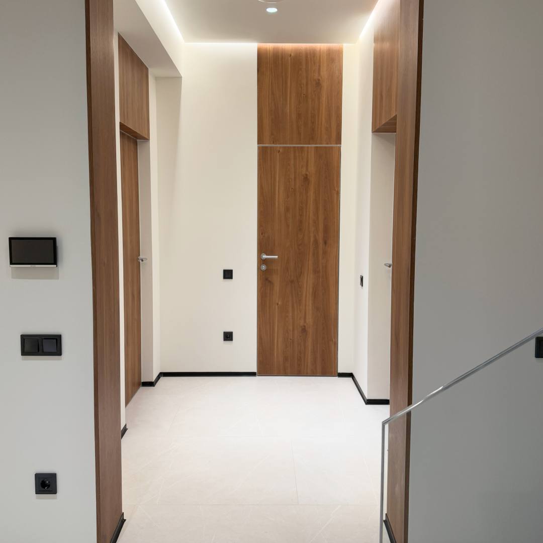Tall wooden door for private home
